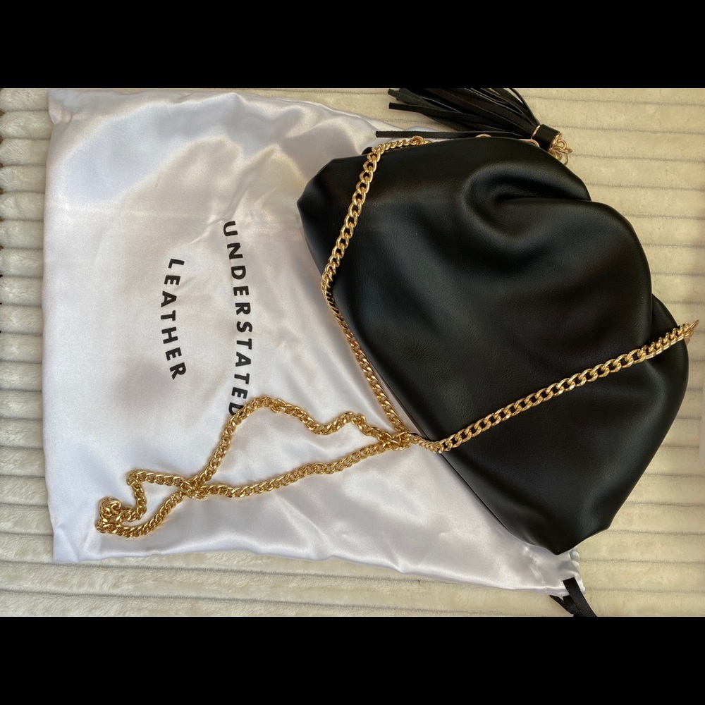 Understated Leather black clutch.